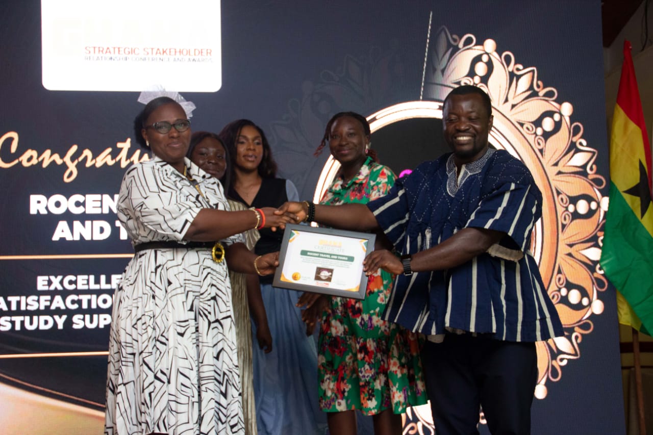 Rocent Travel and Tours receiving award at Strategic Stakeholder Conference